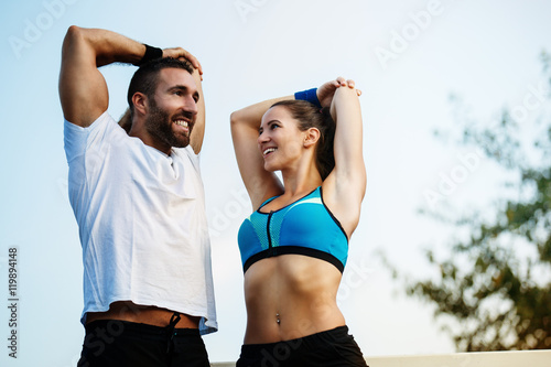 Tablou pe pânză Happy couple exercising outdoors.