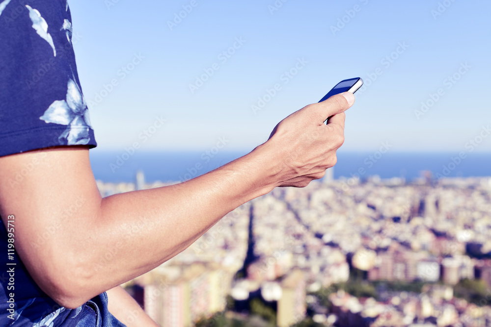 man using his smartphone in Barcelona, Spain