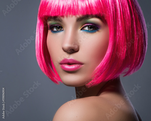 Potrait of young woman with pink hair