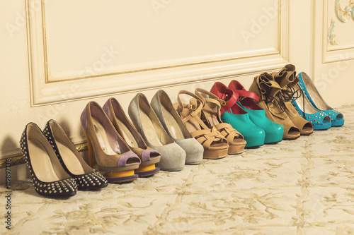 Different female shoes on high heels