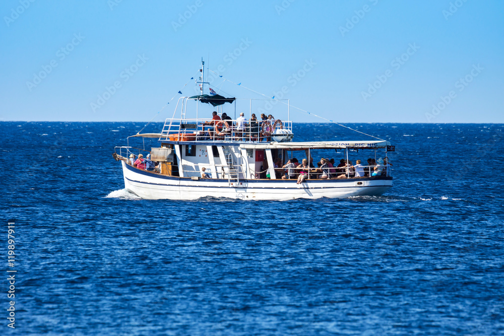 Naklejka premium Typical touring boat on Adriatic sea, Croatia. August 23th, 2016