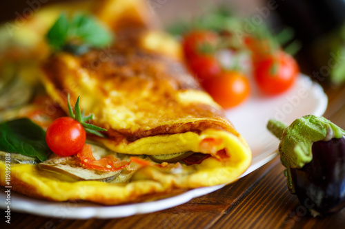 fried omelet with eggplant and tomatoes photo