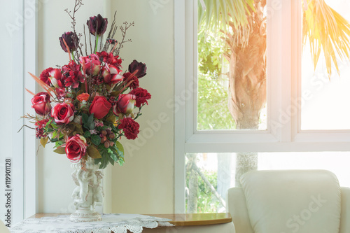 vase of red rose in white living room
