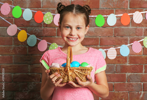 Cute girl with Easter eggs ...