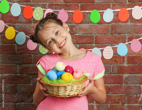 Cute girl with Easter eggs ...