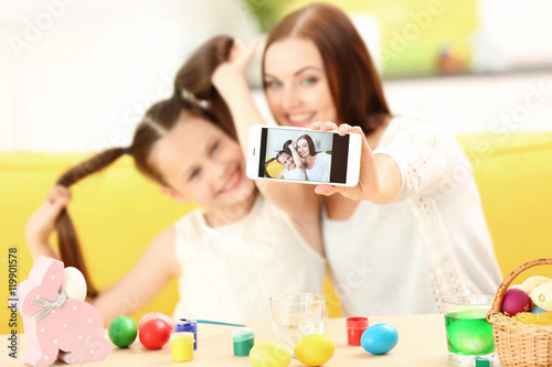 Mother and daughter taking ...