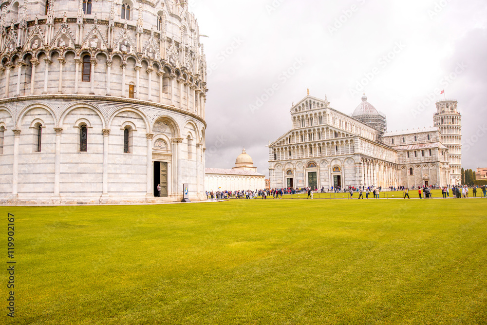 Pisa cathedral with baptistery and leaning tower on the field of Miracles in Pisa town in Italy