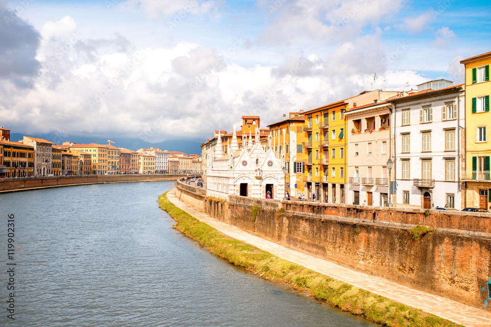 Pisa cityscape view on Arno river with Santa Maria Della Spina church in Italy