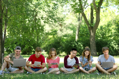 Young people with gadgets i...
