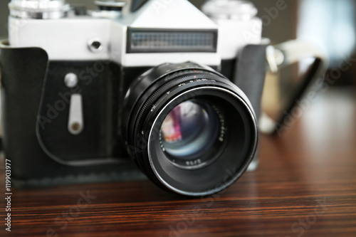 Vintage camera on wooden table