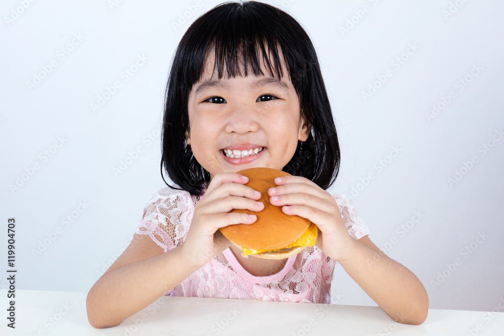 Happy Asian Chinese little girl Eating Burger Happy Asian Chinese little girl Eating Burger