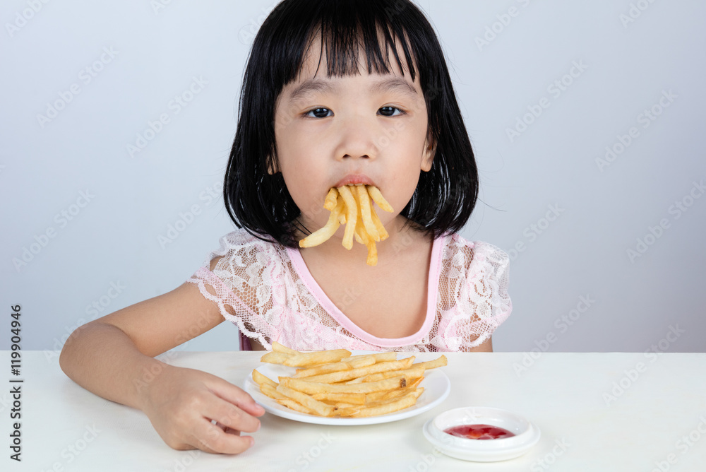 Asian Chinese little girl Refusing Eating French fries Asian Chinese little girl Refusing Eating French fries