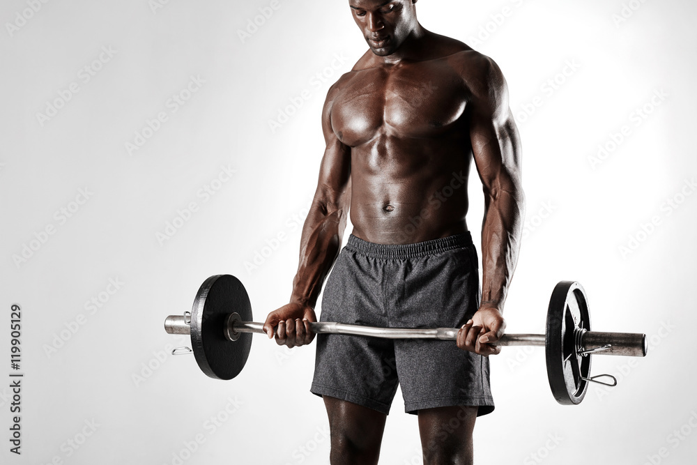 African sportsman exercising with barbell African sportsman exercising with barbell