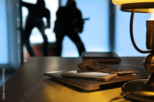Photography Valuables on table in room breaking by thieves