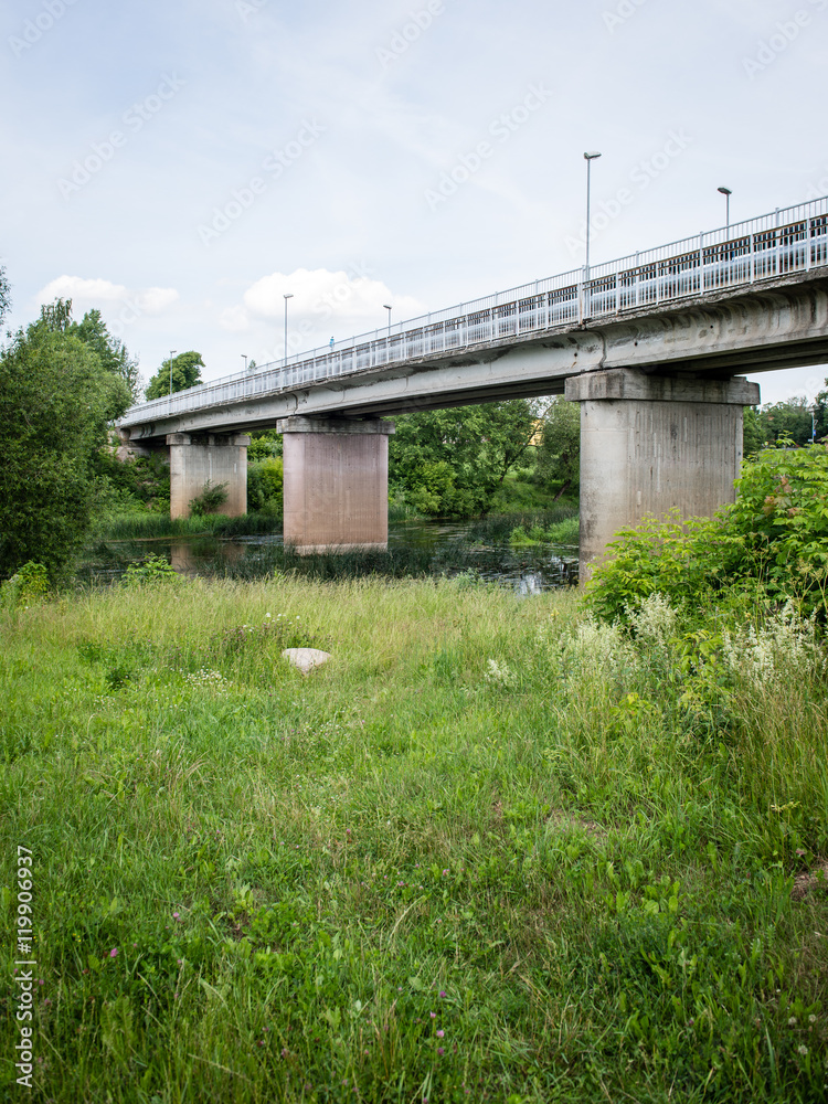 railway bridge with metal rails near river railway bridge with metal rails near river