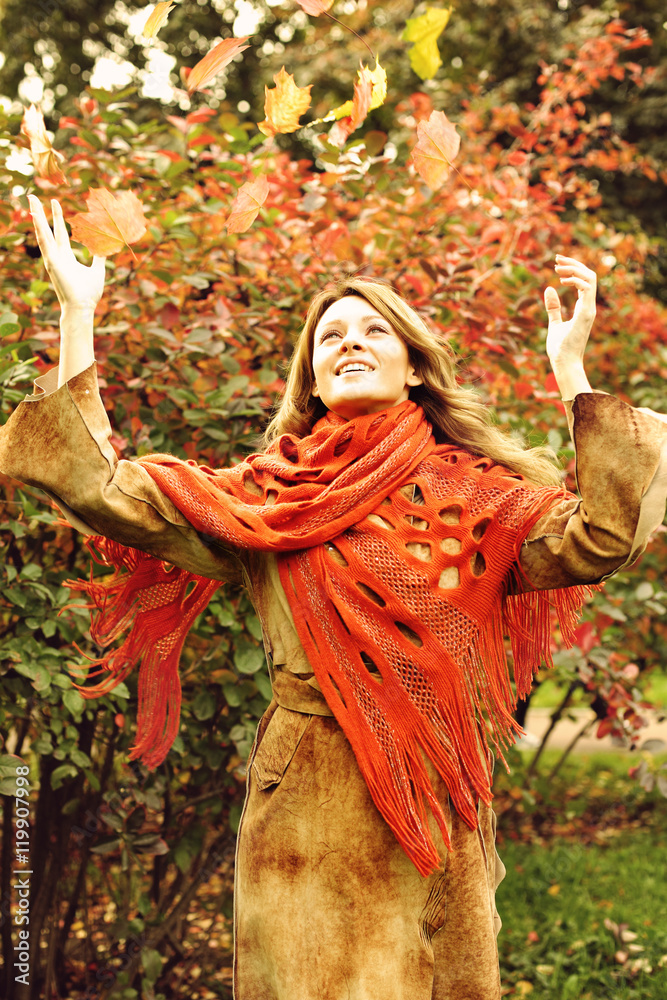 Happy Woman with Fall Leaves in Autumn Park Happy Woman with Fall Leaves in Autumn Park