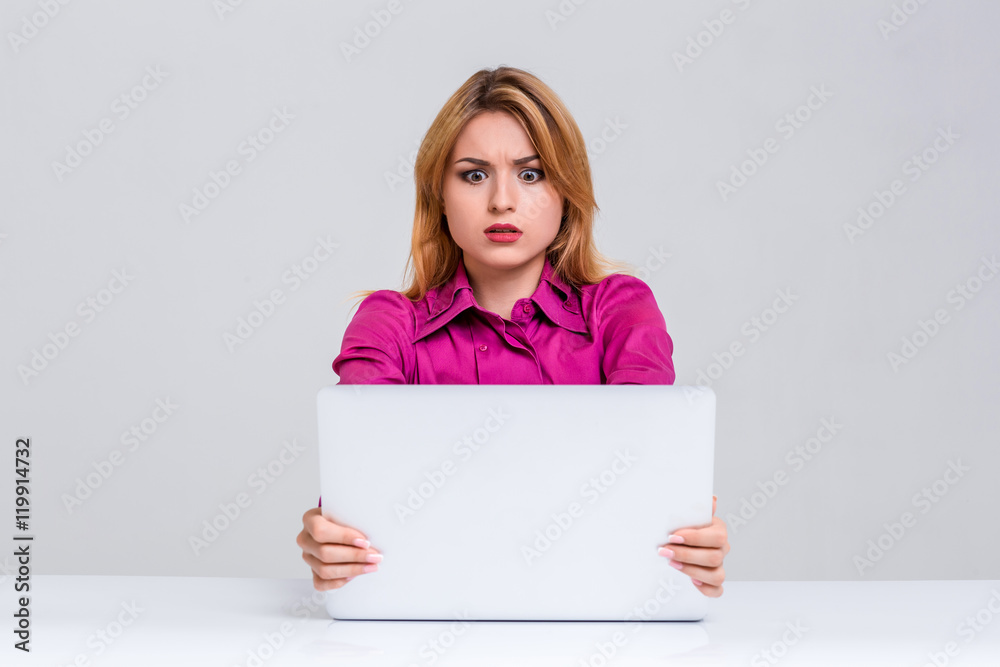 young woman sitting in the table and using laptop young woman sitting in the table and using laptop