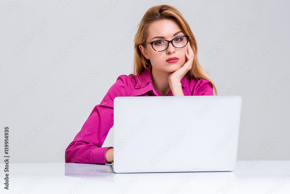 young woman sitting in the table and using laptop young woman sitting in the table and using laptop