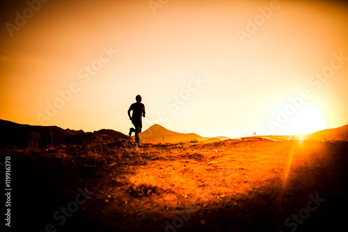 silhouette of man in the mountainous area athletes