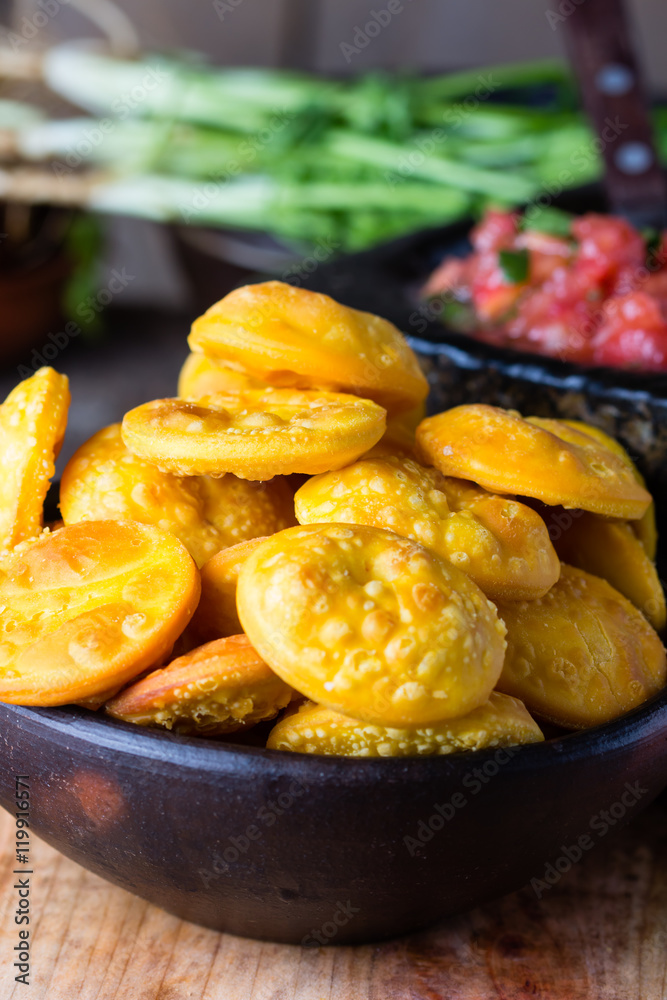 Latin American food. Traditional chilenian homemade pumpkin sopaipillas with salsa