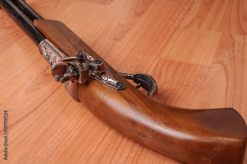 Vintage pistols on wooden background