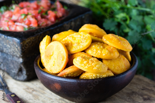 Latin American food. Traditional chilenian homemade pumpkin sopaipillas with salsa photo