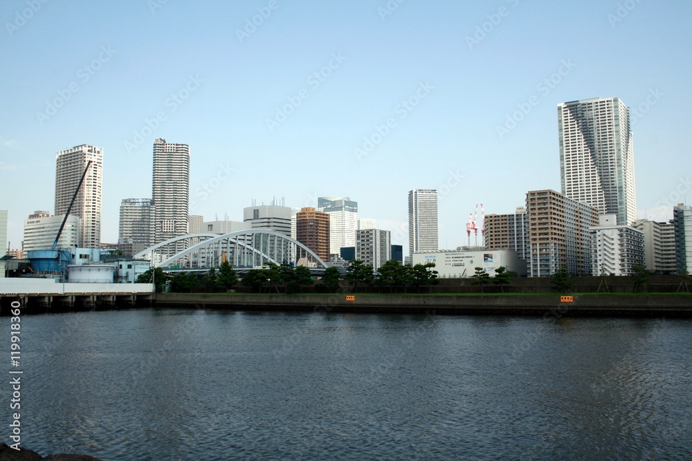A view of the skyscrapers and building in the Chuo district and the Tokyo Bay from the Hamarikyu Teien, in summer
