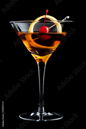 Manhattan cocktails on black background with garnish