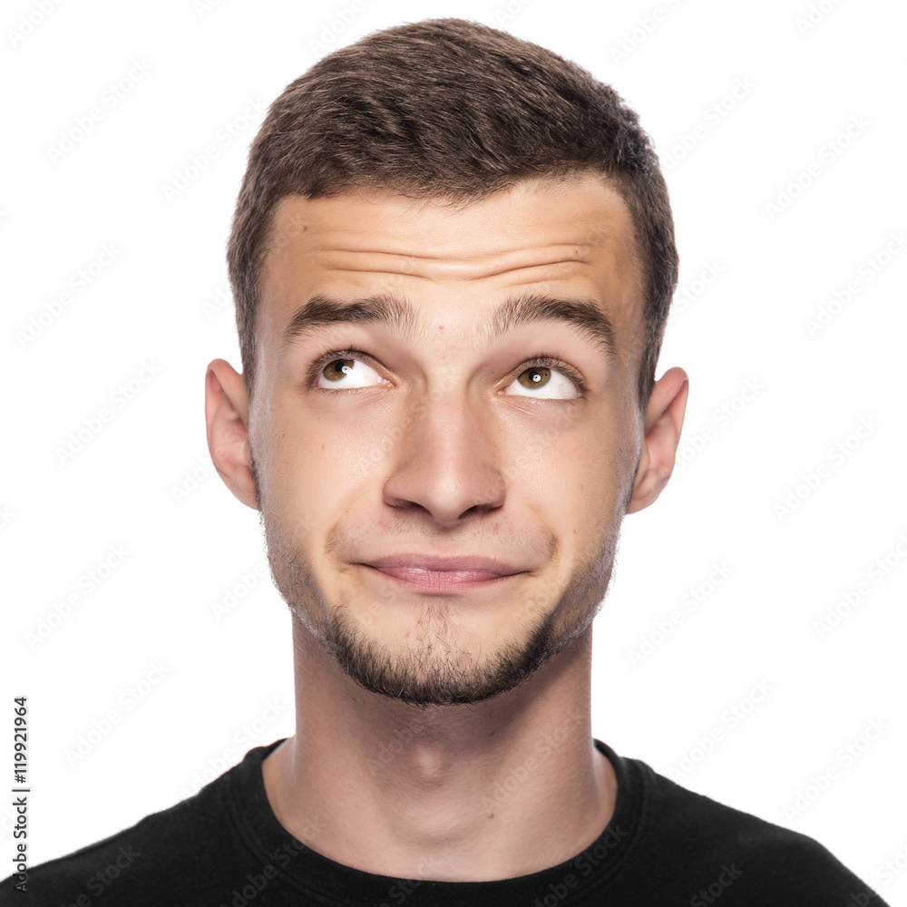 Fototapeta premium Młody człowiek myśli o czymś przyjemnym.