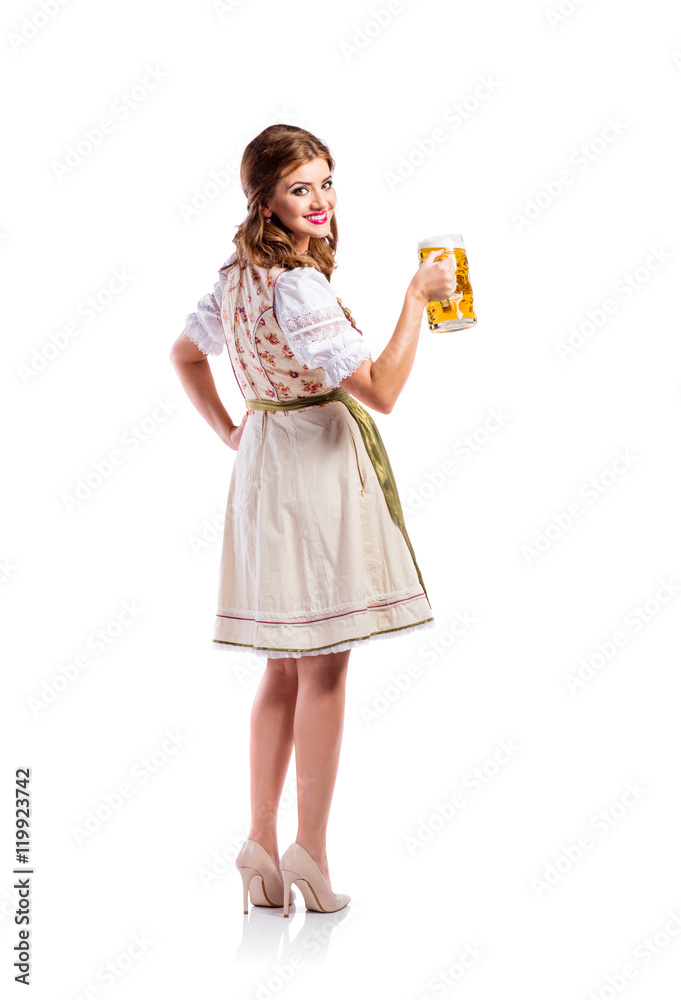 Woman in traditional bavarian dress holding beer Woman in traditional bavarian dress holding beer
