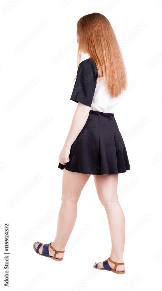 back view of walking woman. beautiful redhead girl in motion. backside view of person. Rear view people collection. Isolated over white background. back view of walking woman. beautiful redhead girl in motion. backside view of person. Rear view people collection. Isolated over white background.