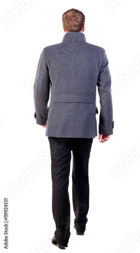 Back view of going young business man in coat. walking young businessman . Rear view people collection. backside view of person. Isolated over white background.