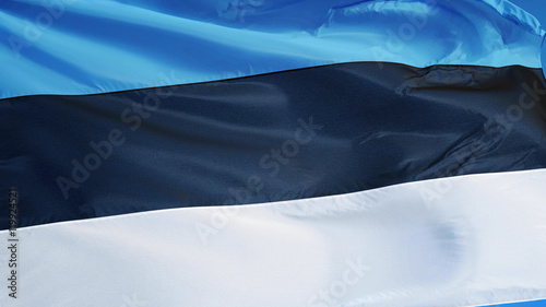 Foto Estonia flag waving against clean blue sky, close up, isolated with clipping pat
