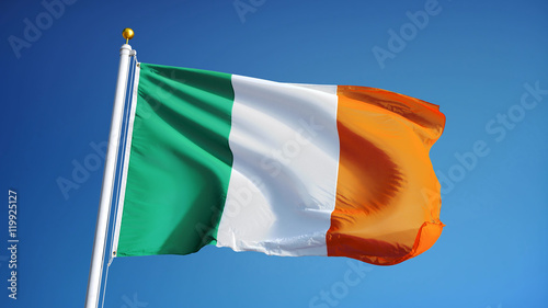 Ireland flag waving against clean blue sky, close up, isolated with clipping path mask alpha channel transparency