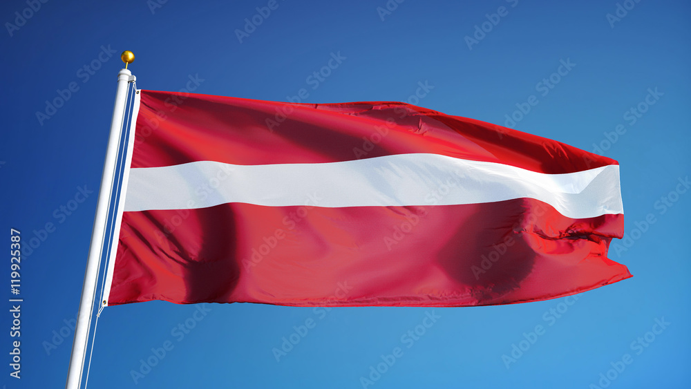 Naklejka premium Latvia flag waving against clean blue sky, close up, isolated with clipping path mask alpha channel transparency