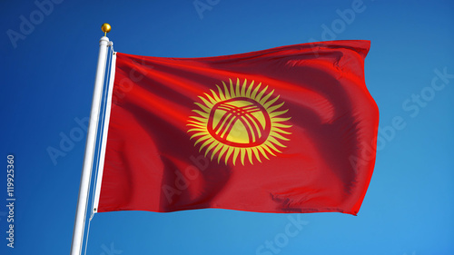Kyrgyzstan flag waving against clean blue sky, close up, isolated with clipping path mask alpha channel transparency photo