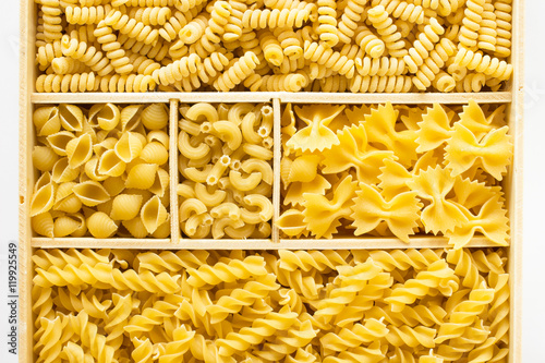 Different kinds of pasta in a wooden box