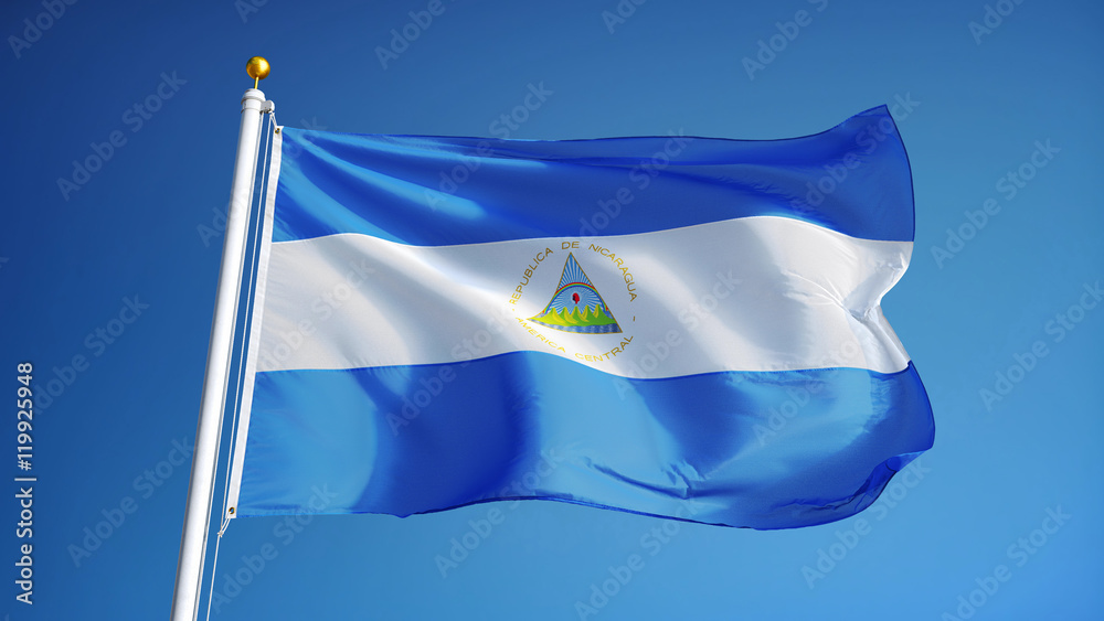 Fototapeta premium Nicaragua flag waving against clean blue sky, close up, isolated with clipping path mask alpha channel transparency