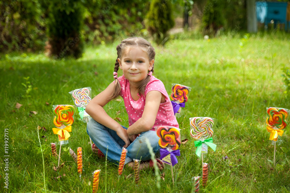 Cute little girl with multicolor lollipops Cute little girl with multicolor lollipops
