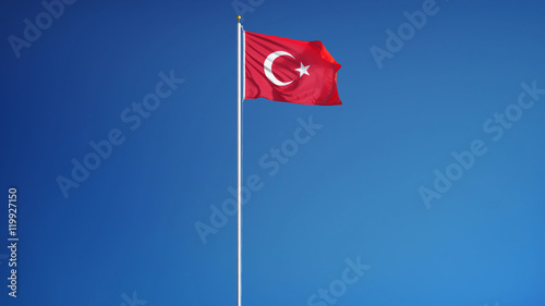 Turkey flag waving against clean blue sky, long shot, isolated with clipping path mask alpha channel transparency