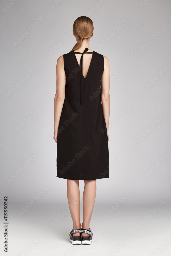 Beautiful sexy woman blond long hair wear black silk dress Beautiful sexy woman blond long hair wear black silk dress