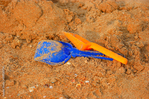 children's sand toys , two shovels on snady surface photo