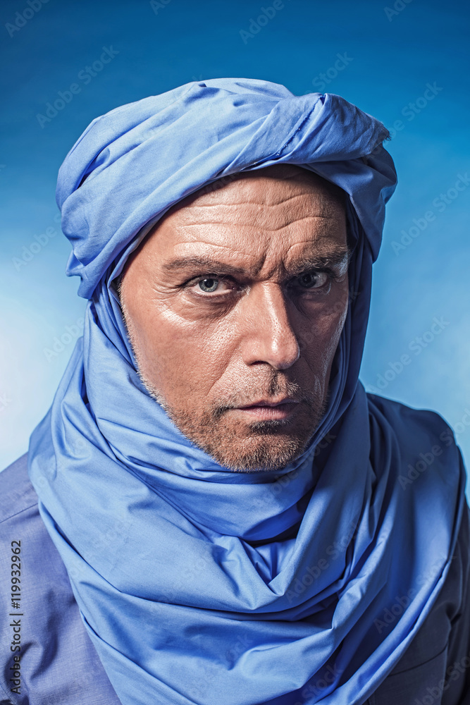 Berber man wearing blue turban. Studio shot. Stock Photo