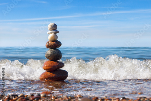 Concept of harmony and balance. Rock Zen near the sea