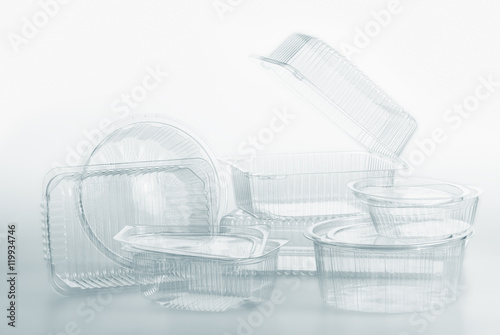 Group of transparent plastic containers box food package on white