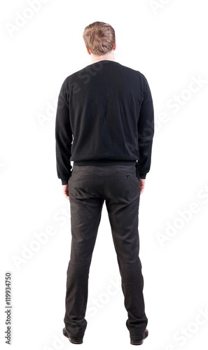 back view of Business man looks ahead. Young guy in sweater watching. Rear view people collection. backside view of person. Isolated over white background. office worker with his hands down looks