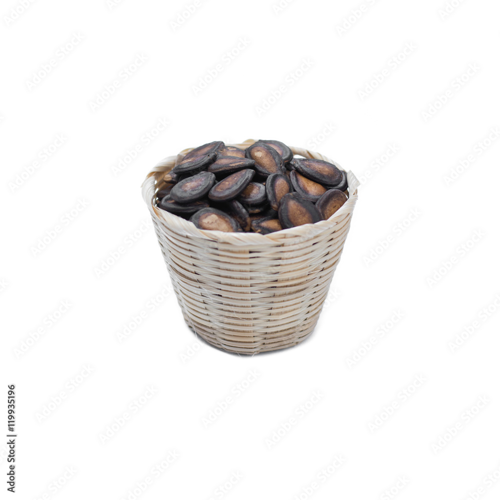 watermelon seeds in bamboo basket isolated on white watermelon seeds in bamboo basket isolated on white