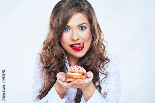 Woman licked lips with cake.