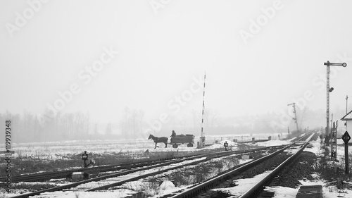 Old, rural railroads and railway station in winter time
