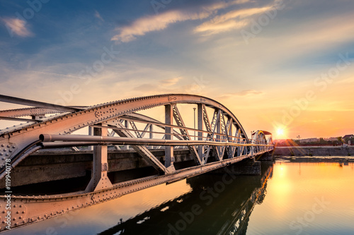 Schilderij op canvas Jiu Bridge at sunset in Targu Jiu, Romania